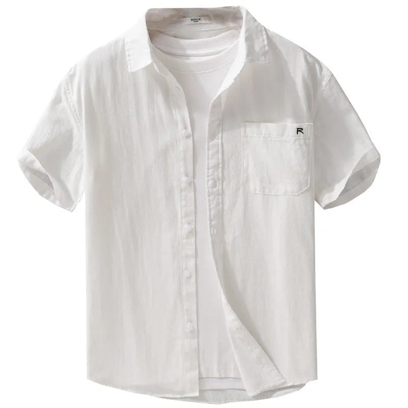 Men's light blue loose fit short-sleeved cotton shirt with a cardigan style front, laid flat.