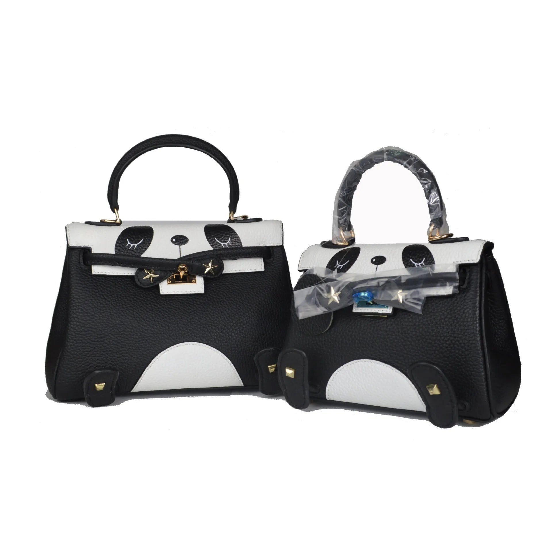 Black and white panda print on a structured horizontal square cowhide leather handbag with top handles.