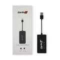 Black Wireless CarPlay USB dongle adapter for connecting iPhone to car navigation screen.