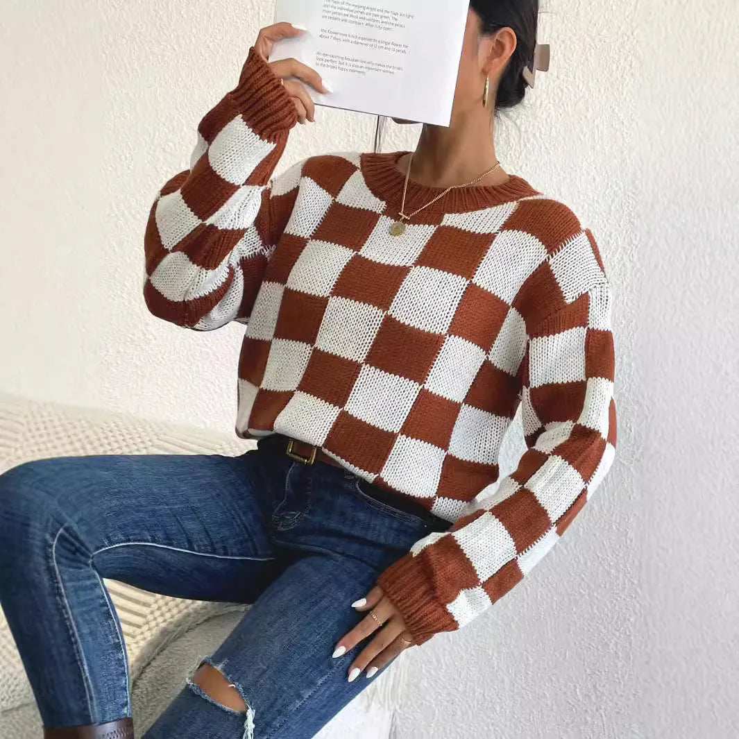 Dark brown loose fit acrylic pullover sweater with a chessboard plaid pattern and long sleeves.