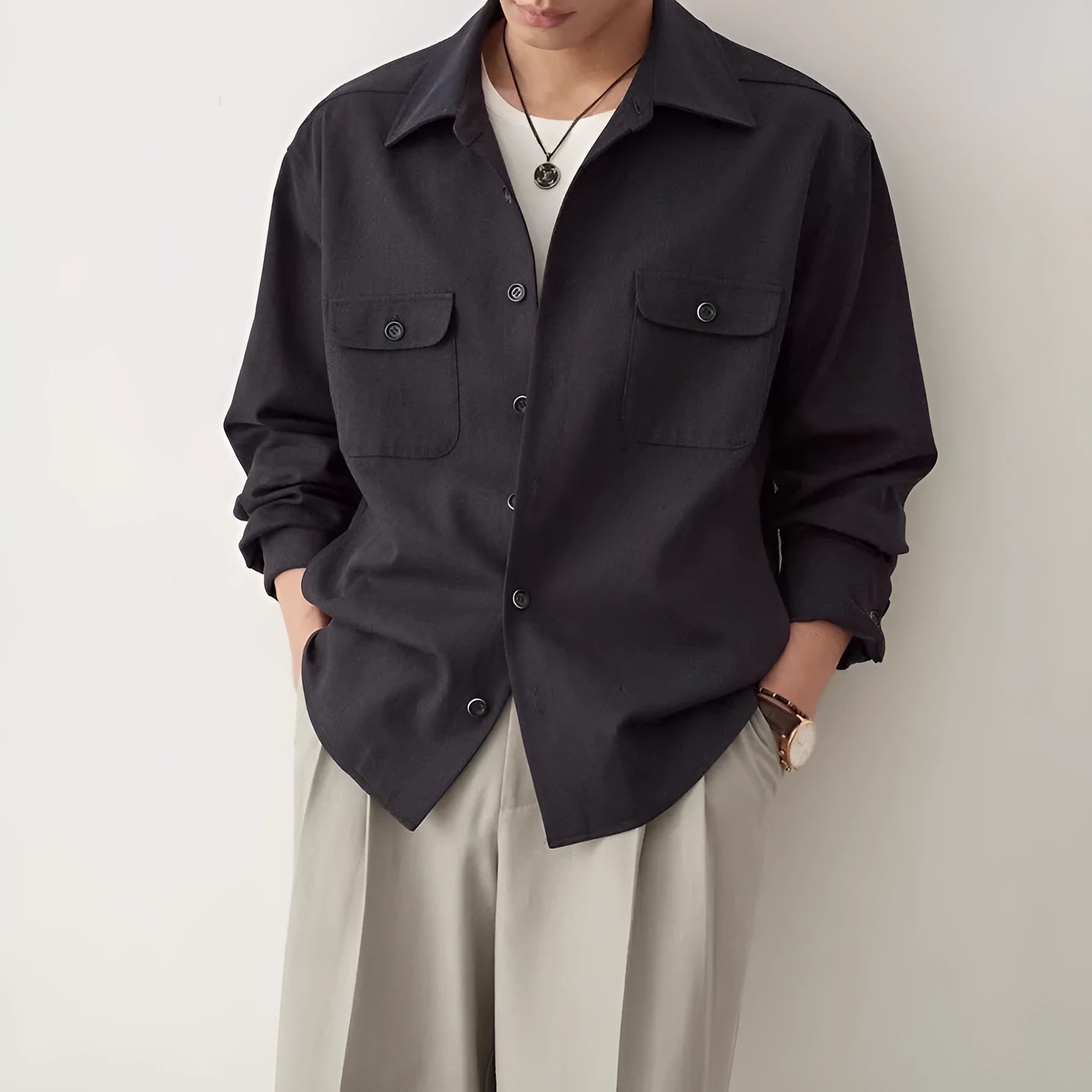 Men's cotton fabric lapel shirt in light sand rice colour on a hanger