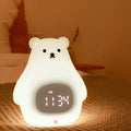 Big White Bear shaped silicone night light with remote control on a bedside table.