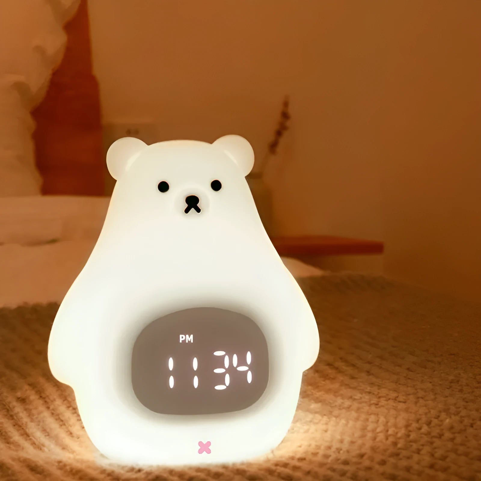 Big White Bear shaped silicone night light with remote control on a bedside table.