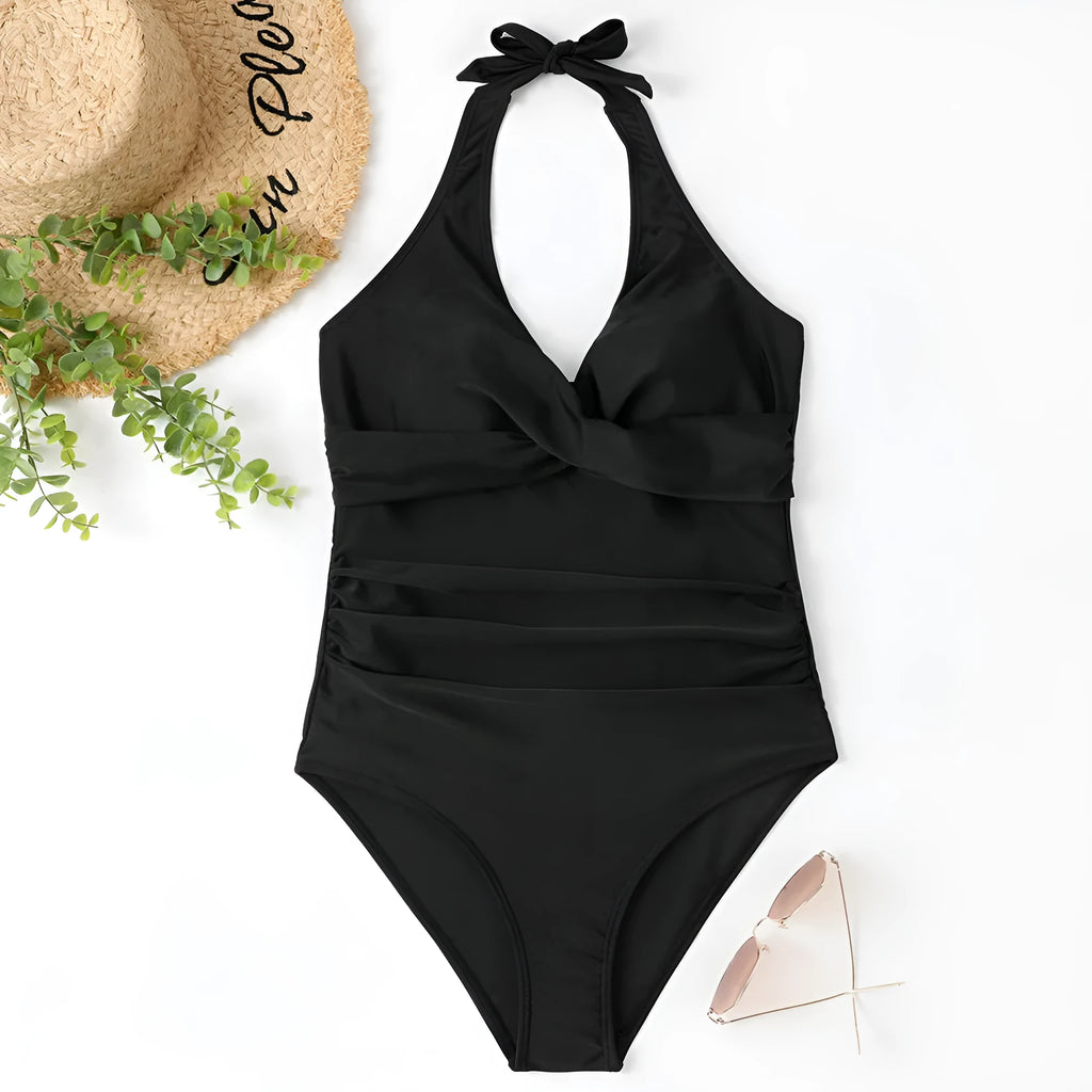 Women's black cross-front one-piece swimsuit made from polyester fabric