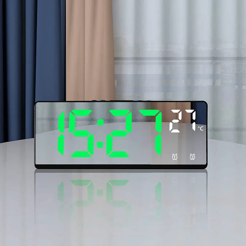 Large screen electronic LED alarm clock showing time and temperature, in a black acrylic casing.