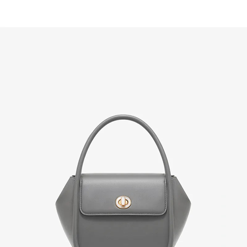 Women's leather wing tote bag in cow leather with buckle detail and cross-body strap