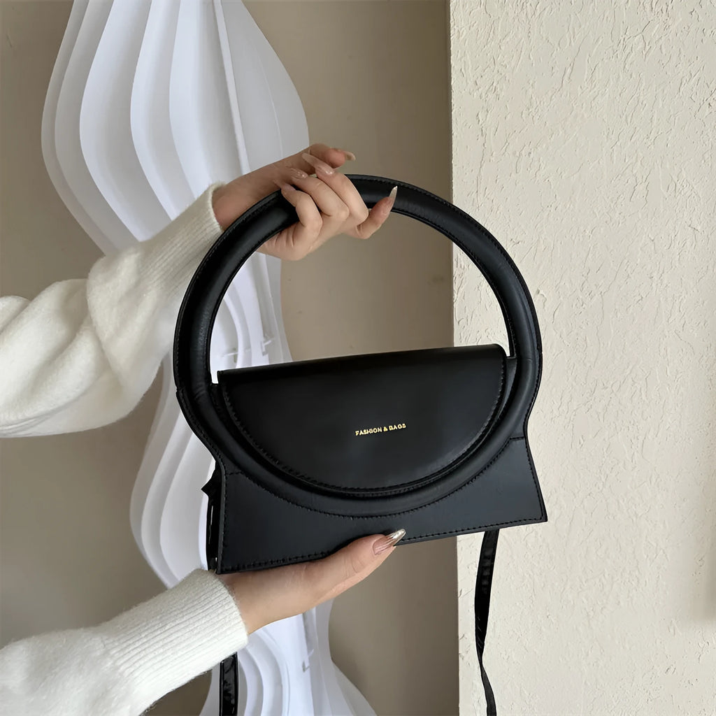 Horizontal square PU messenger bag showing sandwich pocket design and stitching details