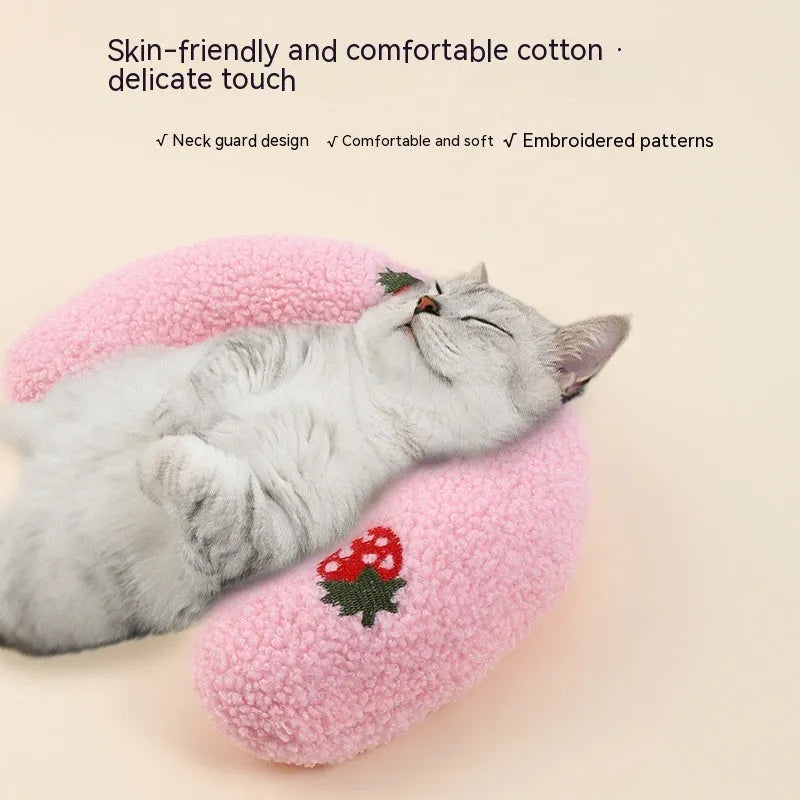 Soft quilted U-shaped cat pillow in blue, 26x18cm, on a clean white background