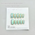 Set of electroplated Cat's Eye false nails in aurora armour style showing short ladder XS, S, and M sizes.
