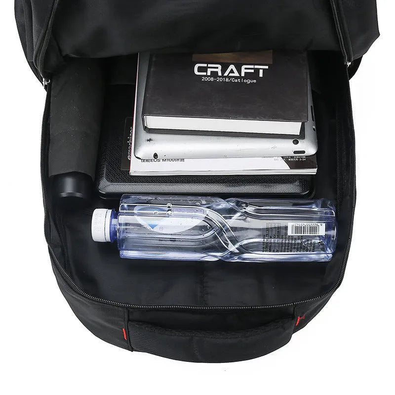 Large nylon laptop travel backpack in black with curved shoulder straps and letter detailing