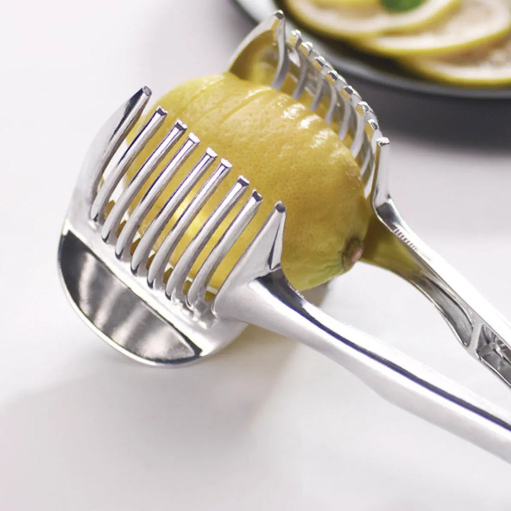Silver plastic lemon slicer kitchen utensil for cutting uniform citrus slices
