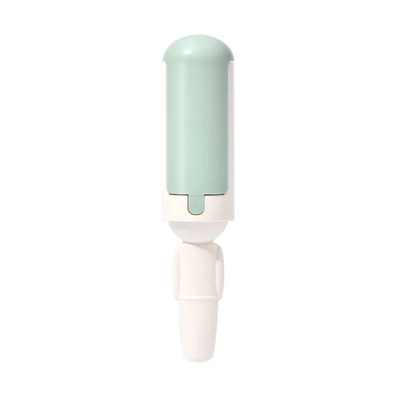 White green pet hair remover roller with self-cleaning base and non-slip handle on a carpet.