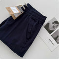 Men's beige loose straight leg casual trousers with an elasticated drawstring waistband laid flat.