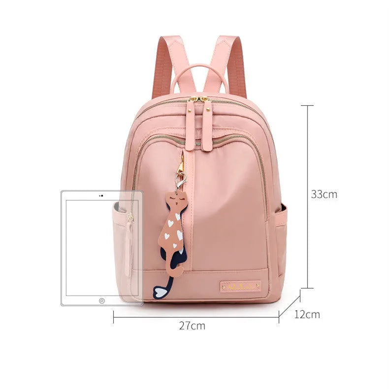 Women's black nylon backpack with anti-theft pockets and water-resistant finish.