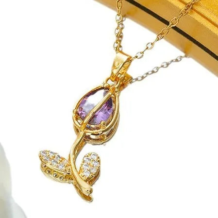 Gold tulip flower pendant necklace on an O-ring chain, showing adjustable length from 41cm to 50cm.
