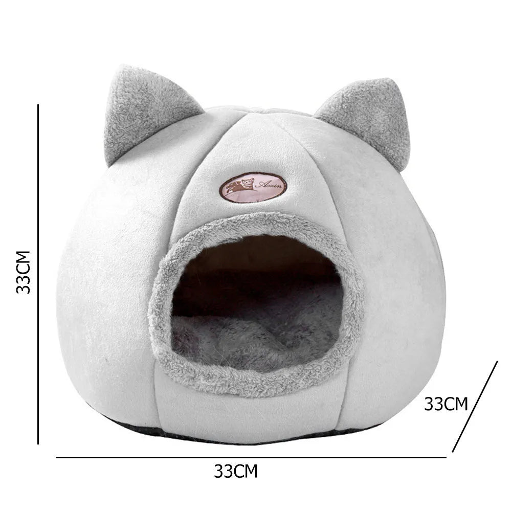 Grey enclosed cat sofa bed with a round entrance hole, showing a soft plush interior and removable cushion.