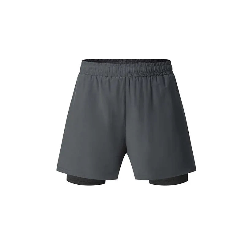 Men's black double-layer running shorts with an inner liner, shown on a size chart.