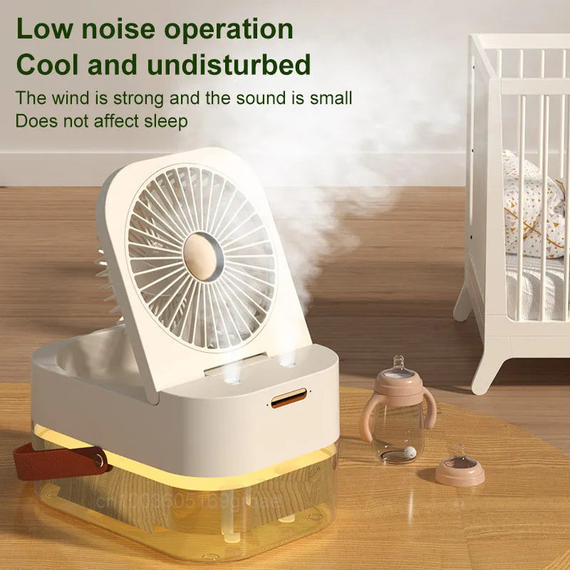 White or green USB desktop humidifier fan with remote control on a wooden desk.