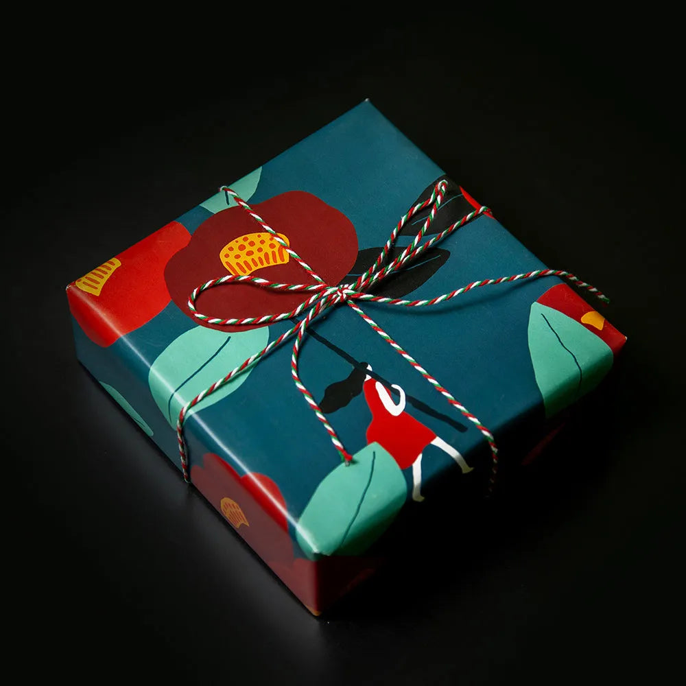 Green fixed tray gift box with camellia motif, waterproof wrapping paper, and black ribbon detail