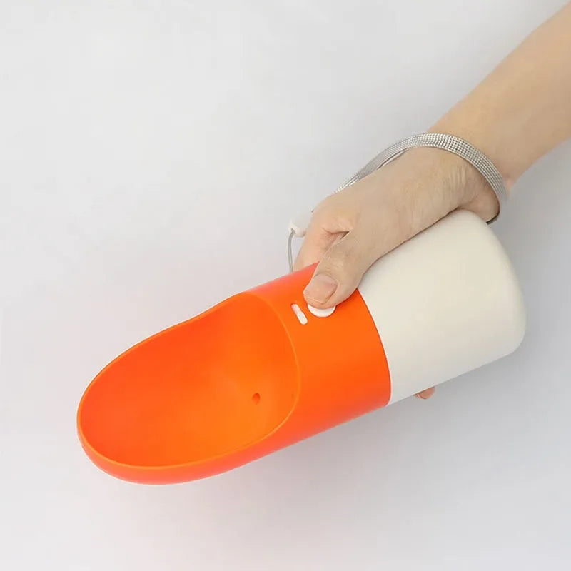 White and grey Moestar Rocket portable pet drinking cup with a one-button lock.