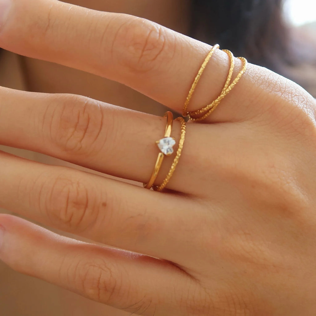 Golden stainless steel simple bracelet with love heart and oval designs showing electroplated surface
