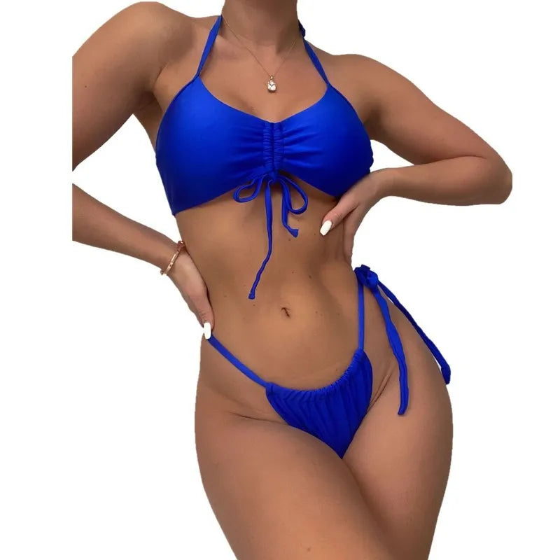 Blue women's neck hanging two-piece swimwear set with bikini top and polyester shorts