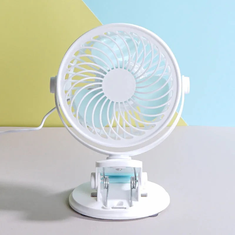 Small white USB desk fan shown in clip-on and floor-standing styles on a wooden desk