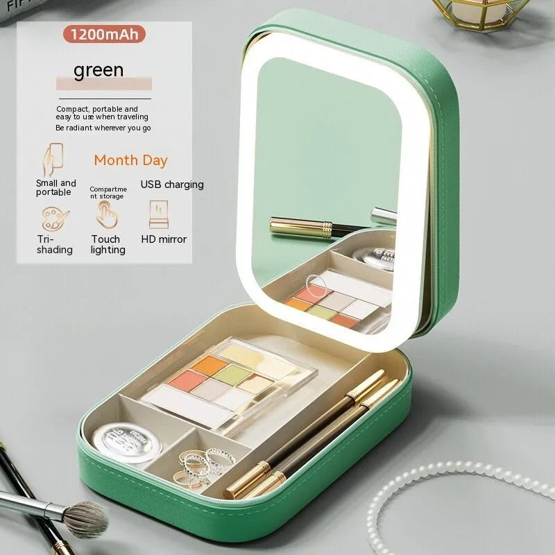 Pink portable makeup storage box with built-in LED light mirror and touch control, showing cosmetic storage compartment.
