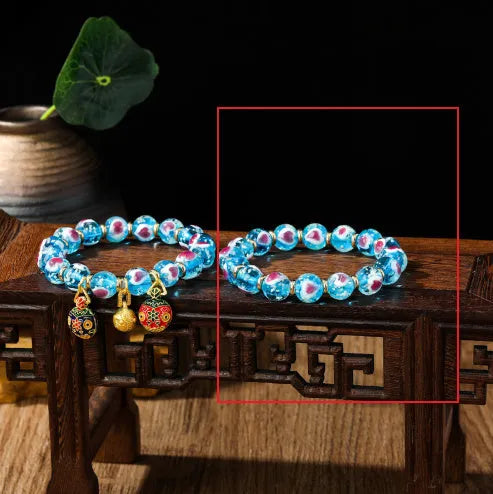 Handmade glass bracelet with swallowing gold beast design on heart-shaped 10mm beads