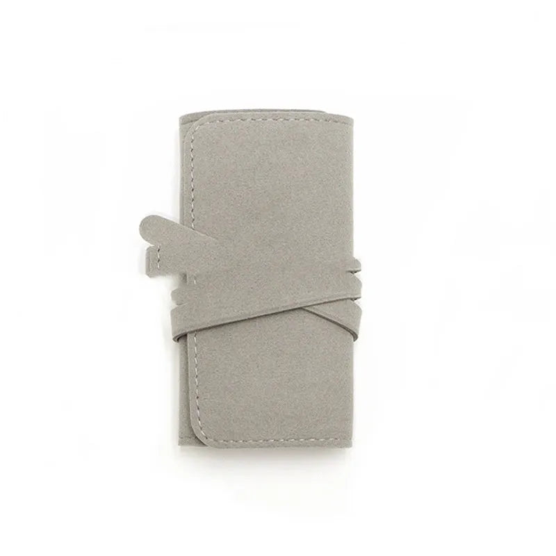 Brown PU leather and microfiber jewellery storage bag for earrings, rings and watches.