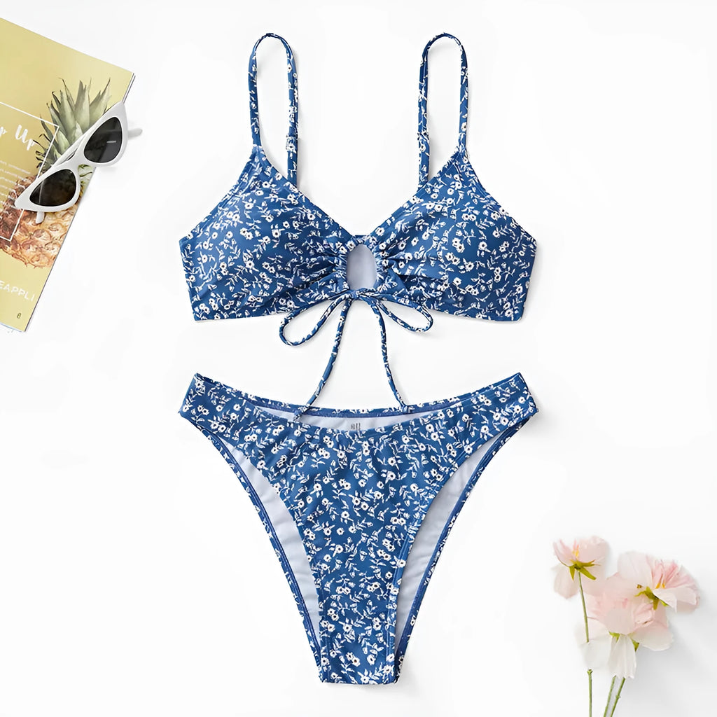 Blue women's three-piece swimsuit set comprising a top and shorts on a mannequin.