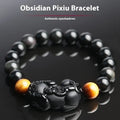 Black obsidian crystal Pi Xiu bracelet with ethnic styling and spiritual symbolism