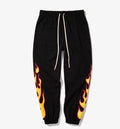 Hop flame print joggers for men and women in black, loose fit cotton blend sweatpants with red, blue flame pattern