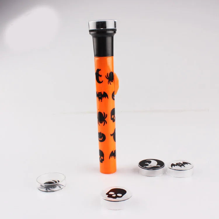Orange metal pumpkin skull flashlight projection lamp with textured metal finish