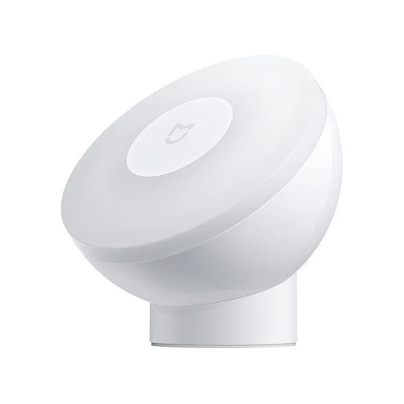 White modern bedside table lamp with human body induction and Bluetooth.