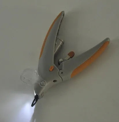 Dog nail trimmer with LED light and blood line indicator on blister card packaging