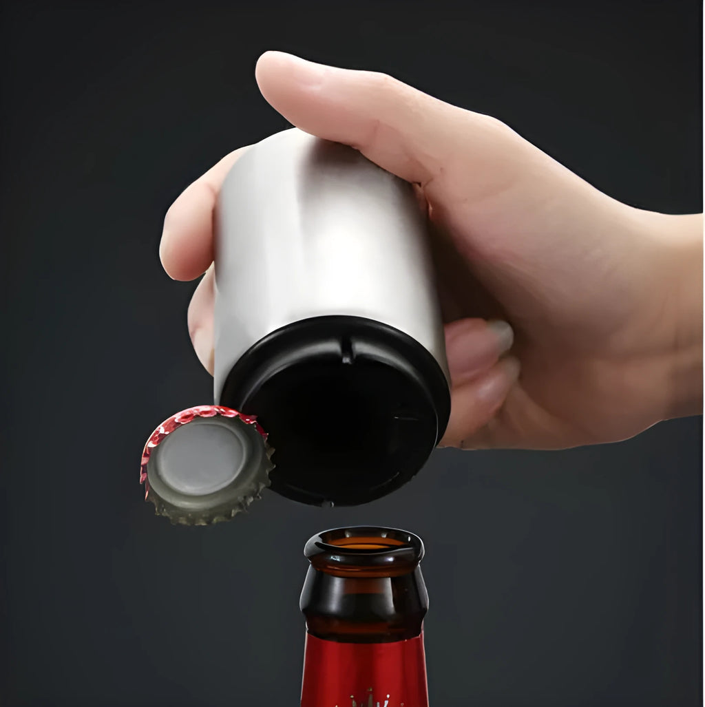 Stainless steel automatic bottle opener showing one-handed operation on beer bottle