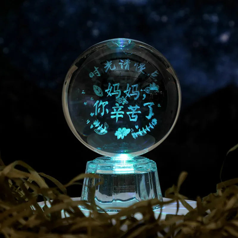 Transparent 6cm crystal ball ornament with inner carving on a fixed base, modern minimalist decor.