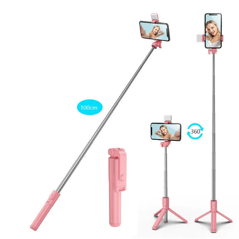 Black Bluetooth selfie stick with extended tripod legs holding an iPhone, showcasing its 360-degree rotating phone holder.