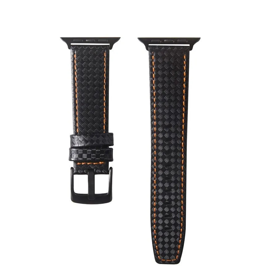Leather and carbon fibre Apple Watch strap with red stitching next to a black PC case with carbon fibre pattern.
