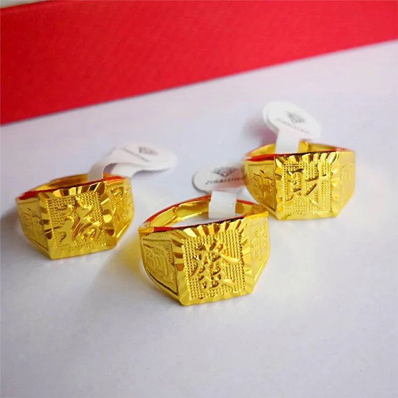 Square men's alloy ring with electroplated yellow finish on plain background