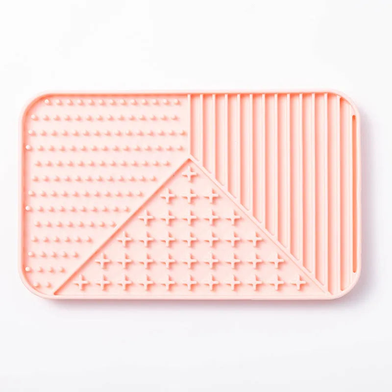 Silicone pet licking mat with textured surface and suction cup base in grey, khaki, or pink colour.