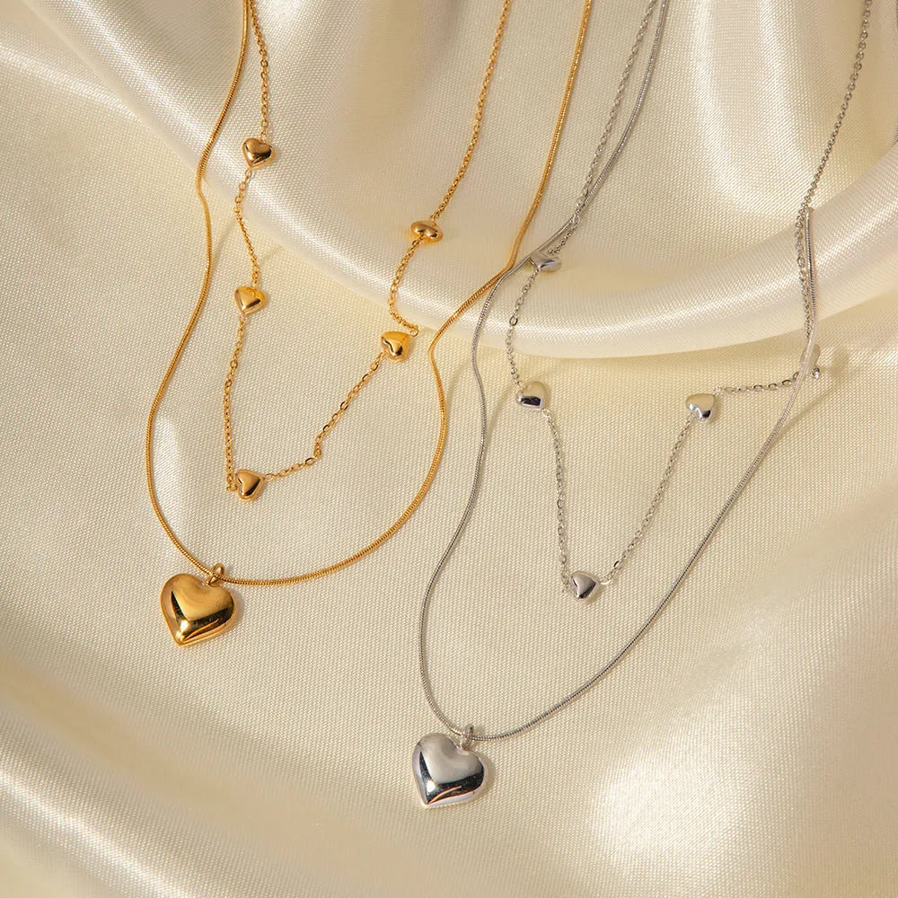 Love double-layer 18K gold-plated collarbone necklace with snake pendant for women on display