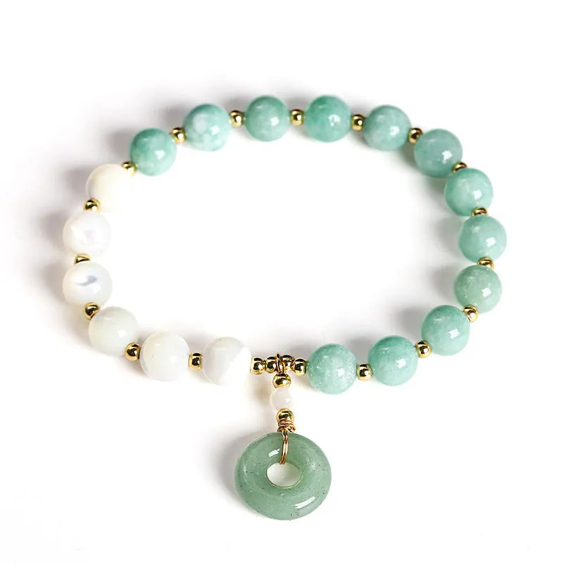 Women's Burma jade bracelet with copper horseshoe screw safety clasp showing 8mm round beads