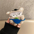Hand-knitted grey koala bear design cover on a white Airpods case.