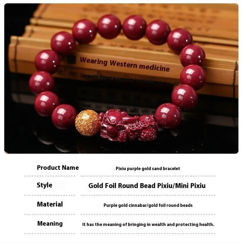 Polished purple and gold sandstone cinnabar bracelet with totem design on a wrist.