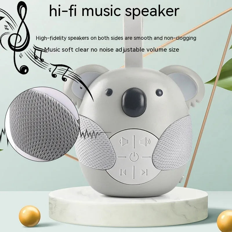 Koala-shaped infant white noise player toy in fox colour on a surface