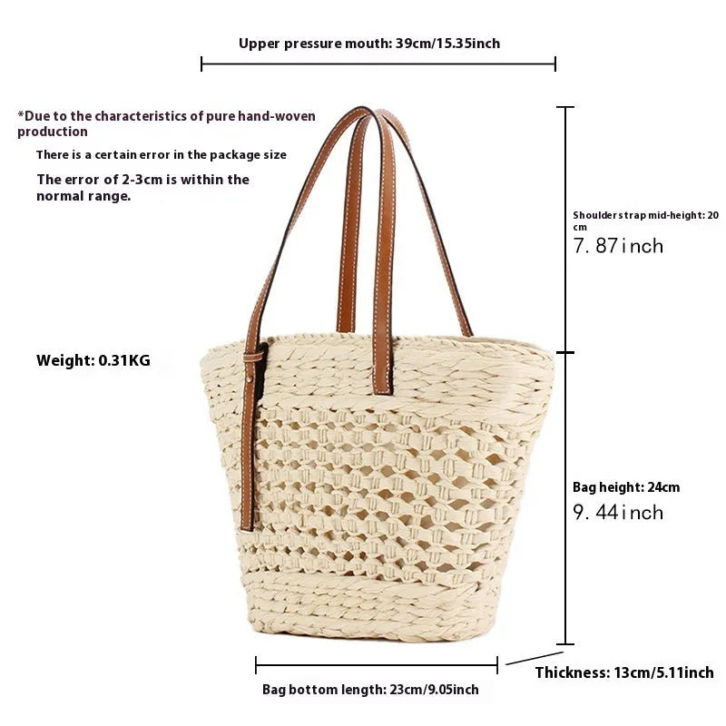 Beige horizontal square woven paper-string shoulder bag showing wide opening and adjustable strap