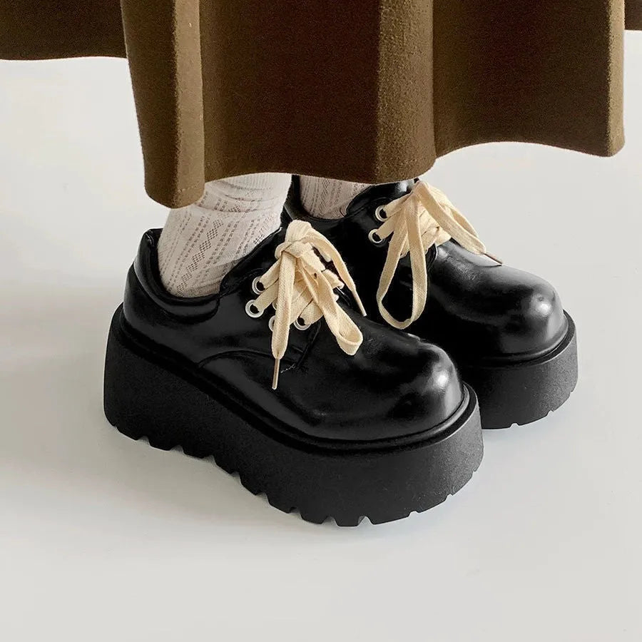 Women's matte black retro lace-up shoes with a thick rubber sole and chunky 6-8cm muffin heel.