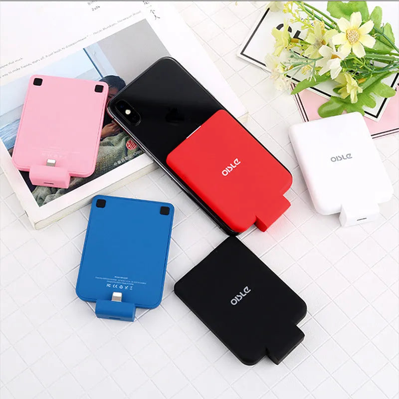 MP282P back clip battery power bank in multiple colours next to a smartphone.